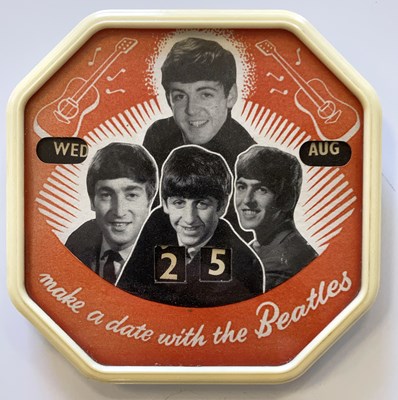 Lot 190 - THE BEATLES - CALENDAR CLOCK.