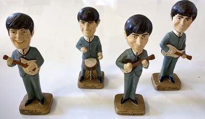 Lot 369 - BEATLES CAR MASCOTS NODDING HEAD DOLLS.
