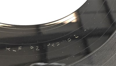Lot 104 - THE KLF - AMERICA: WHAT TIME IS JANUARY 12" (ORIGINAL WHITE LABEL PROMO - KLF 92 PROMO 2)