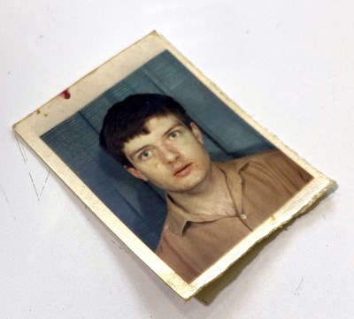 Lot 253 - JOY DIVISION - IAN CURTIS - A SIGNED PASSPORT PHOTOGRAPH - THE LAST PHOTO OF IAN.