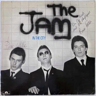 Lot 313 - THE JAM - IN THE CITY SIGNED BY PAUL WELLER / BRUCE FOXTON.