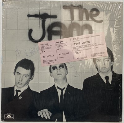 Lot 495 - THE JAM - IN THE CITY SIGNED BY WELLER / FOXTON & UNUSED TICKET FOR CANCELLED GIG