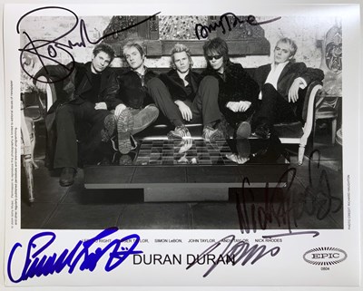 Lot 326 - DURAN DURAN - A SIGNED 8 X 10" PHOTOGRAPH.