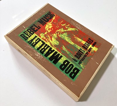 Lot 79 - BOB MARLEY REBEL MUSIC GENESIS PUBLICATIONS - DELUXE COPY SIGNED BY ERIC CLAPTON.