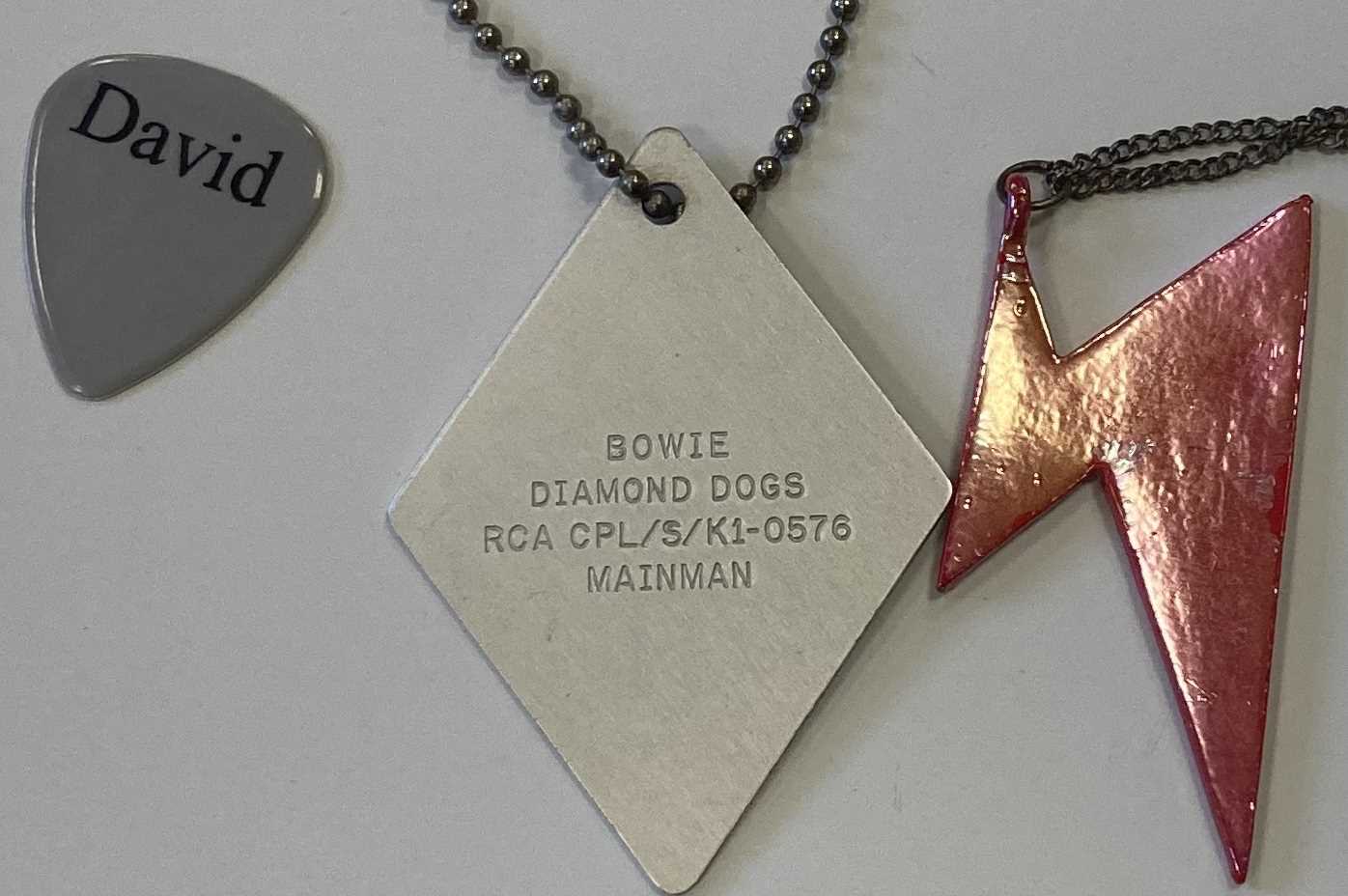 Lot 239 - DAVID BOWIE PENDANTS / DOGTAG / PLECTRUM