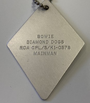 Lot 239 - DAVID BOWIE PENDANTS / DOGTAG / PLECTRUM