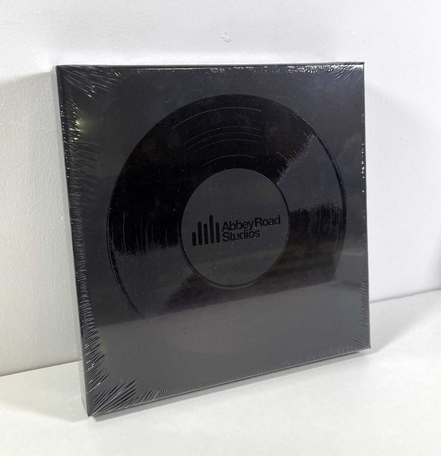 Lot 99 - THE BEATLES - STILL SEALED SPECIAL EDITION ABBEY ROAD BOOK SIGNED BY GEORGE MARTIN.