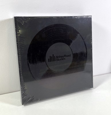 Lot 99 - THE BEATLES - STILL SEALED SPECIAL EDITION ABBEY ROAD BOOK SIGNED BY GEORGE MARTIN.