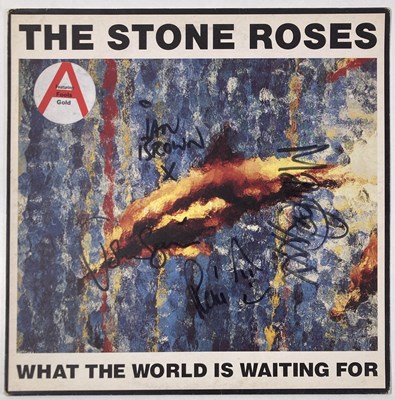 Lot 305 - THE STONE ROSES - FULLY SIGNED COPY OF 'WHAT THE WORLD IS WAITING FOR'.