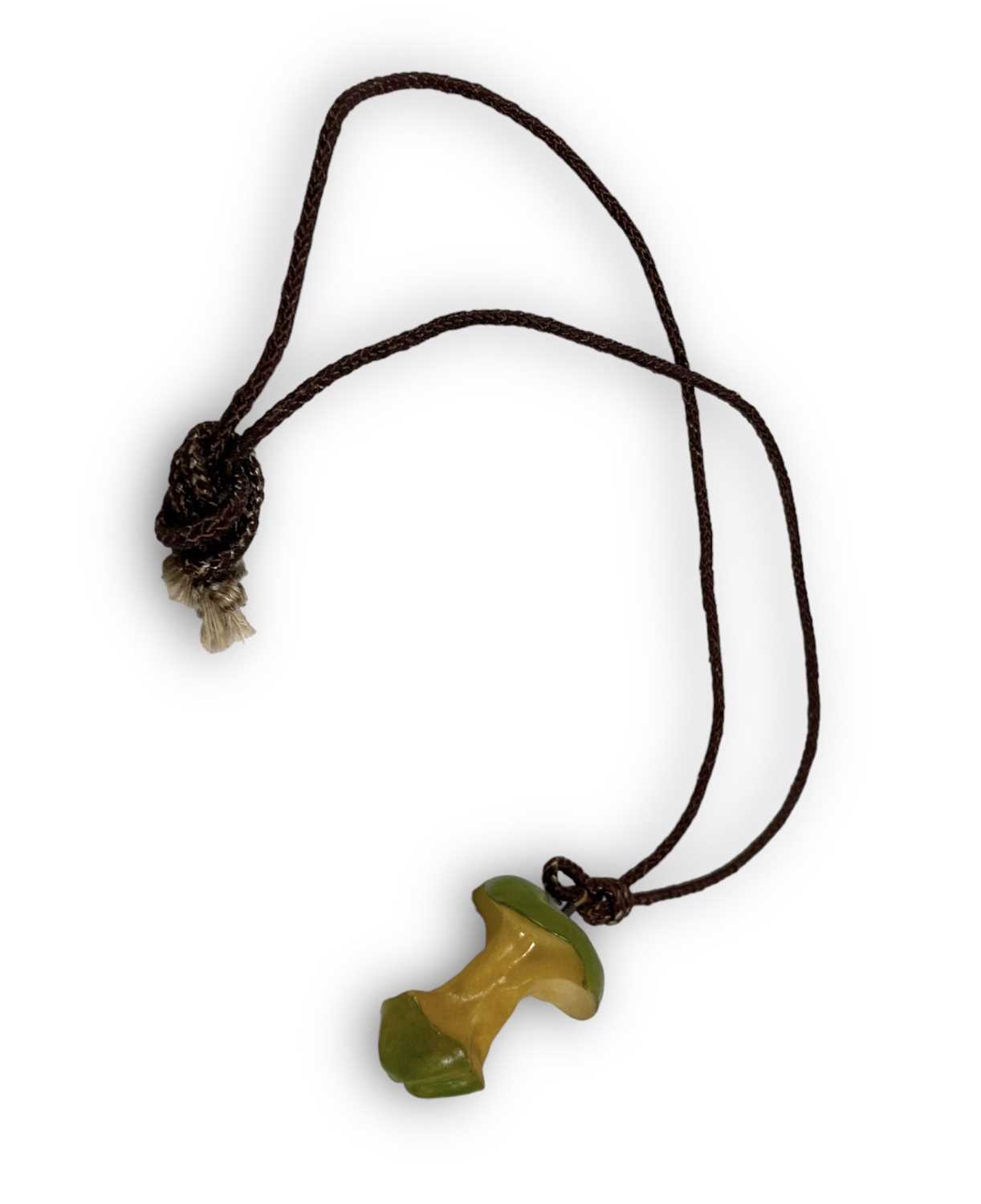 Lot 175 - THE BEATLES-  RARE APPLE EMPLOYEE ISSUE APPLE CORE PENDANT.