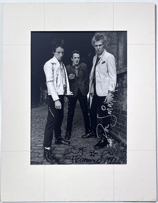 Lot 45 - THE CLASH - PAUL SIMONON AND JOE STRUMMER SIGNED PHOTOGRAPH.