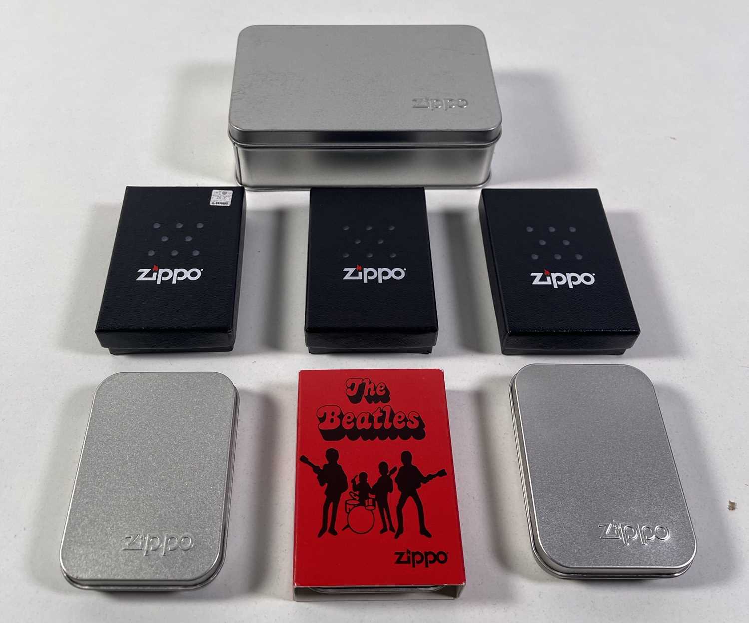 Lot 363 - THE BEATLES - COLLECTION OF SEVEN ZIPPO LIGHTERS - ALL UNSTRUCK.