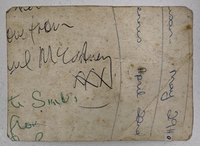 Lot 332 - THE BEATLES - CUTTING FROM AN ORIGINAL PHOTOGRAPH WITH PARTIAL SIGNATURES OF MCCARTNEY / LENNON.