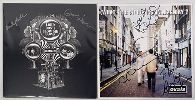 Lot 40 - OASIS - SIGNED COPY OF 'WHAT'S THE STORY...'