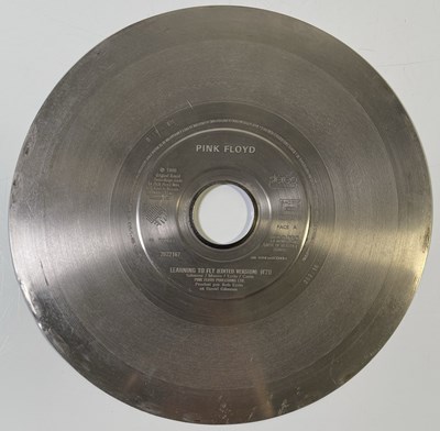 Lot 407 - PINK FLOYD - ORIGINAL METAL PRESSING DISC FOR 'LEARNING TO FLY'.