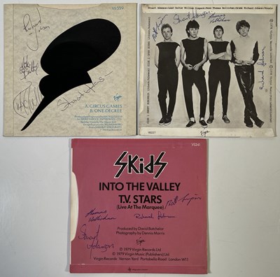 Lot 305 - SKIDS - THREE SIGNED 7" SINGLES.