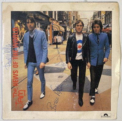 Lot 482 - THE JAM - SIGNED COPY OF 'THE NEWS OF THE WORLD'.