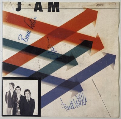 Lot 483 - THE JAM - SIGNED COPY OF 'THE NEWS OF THE WORLD'.