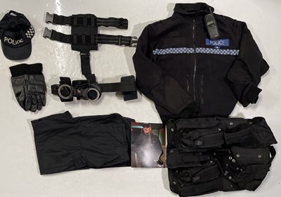 Lot 229 - PROPS AND PRODUCTION USED ITEMS INC ATTACK THE BLOCK POLICE COSTUME.