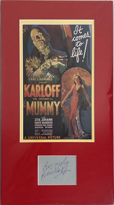 Lot 61 - BORIS KARLOFF - SIGNED PAGE IN MOUNTED DISPLAY.