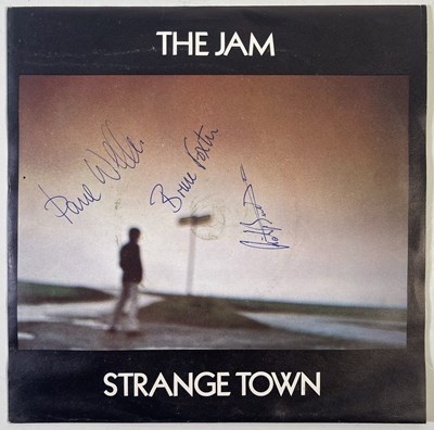 Lot 371 - THE JAM - SIGNED COPY OF 'STRANGE TOWN'.
