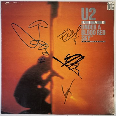 Lot 442 - U2 - SIGNED COPY OF 'UNDER A BLOOD RED SKY'.
