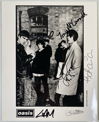 Lot 519 - OASIS - FULLY SIGNED CREATION PROMO PHOTO.