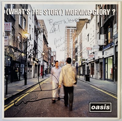 Lot 521 - OASIS - FULLY SIGNED COPY OF 'WHAT'S THE STORY..'.