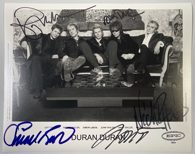 Lot 423 - DURAN DURAN - SIGNED 8X10" PHOTO.