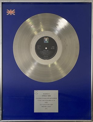 Lot 392 - STEELY DAN - ORIGINAL BPI SILVER DISC AWARD FOR 'PRETZEL LOGIC'.
