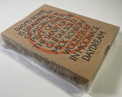 Lot 431 - DAVID BOWIE - BOWIE SIGNED V&A 'IS' BOOK IN ORIGINAL PACKAGING, UNOPENED.