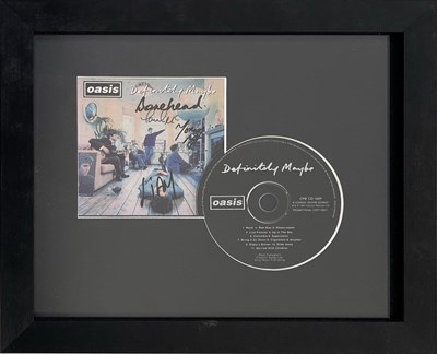 Lot 438 - OASIS - FULLY SIGNED DEFINITELY MAYBE PROMO CD PRESENTATION.
