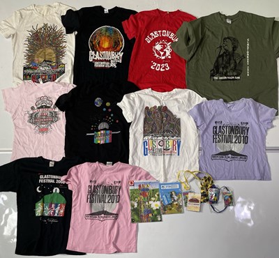 Lot 121 - GLASTONBURY FESTIVAL - T-SHIRT COLLECTION INC PROGRAMMES AND MEMORABILIA.