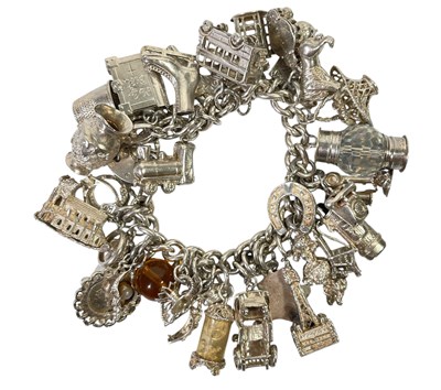 Lot 14 - SILVER CHARMS.