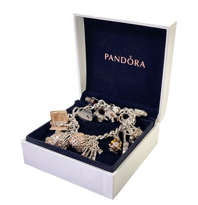 Lot 15 - SILVER JEWELLERY - STERLING SILVER CHARM BRACELET.