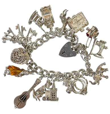 Lot 15 - SILVER JEWELLERY - STERLING SILVER CHARM BRACELET.