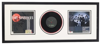 Lot 173 - THE STROKES - SIGNED 12.51 DISPLAY.