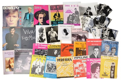 Lot 34 - MUSIC MEMORABILIA INC BADGES / MAGAZINE /VHS.
