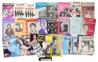 Lot 34 - MUSIC MEMORABILIA INC BADGES / MAGAZINE /VHS.