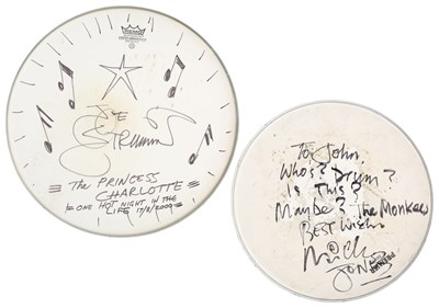 Lot 506 - THE CLASH - JOE STRUMMER AND MICK JONES - SIGNED AND DOODLED DRUMSKINS.