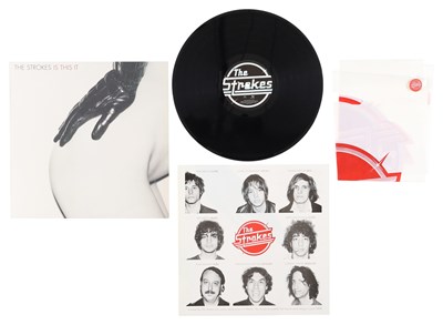 Lot 62 - THE STROKES - 'THIS IS IT' LP - UK 1ST PRESS W/ CARRIER BAG AND PIN BADGE (2,000 COPIES)