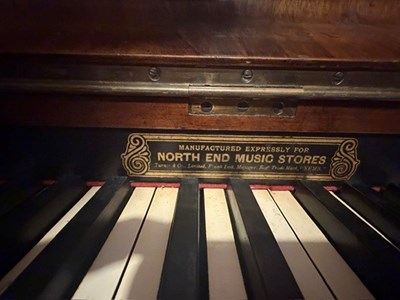Lot 190 - THE BEATLES INTEREST - ANTIQUE PIANO WITH NEMS RETAILER DECAL.